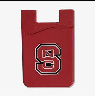 A red card holder or wallet featuring the NC State Wolfpack logo in red, white, and black, shown on a light gray background.