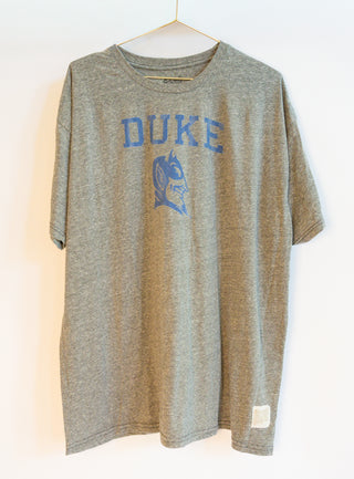 Gray t-shirt with 'DUKE' and blue devil on a white background