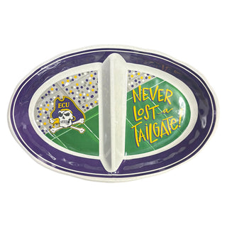 An oval ceramic divided serving platter with a purple rim, white center divider, green field background, purple and white polka dots, and yellow text reading 'NEVER LOST-a TAILGATE!' with an ECU skull-and-crossbones logo.