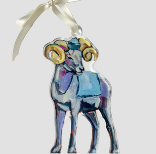 Decorative ornament of a ram with a blue book on a white background